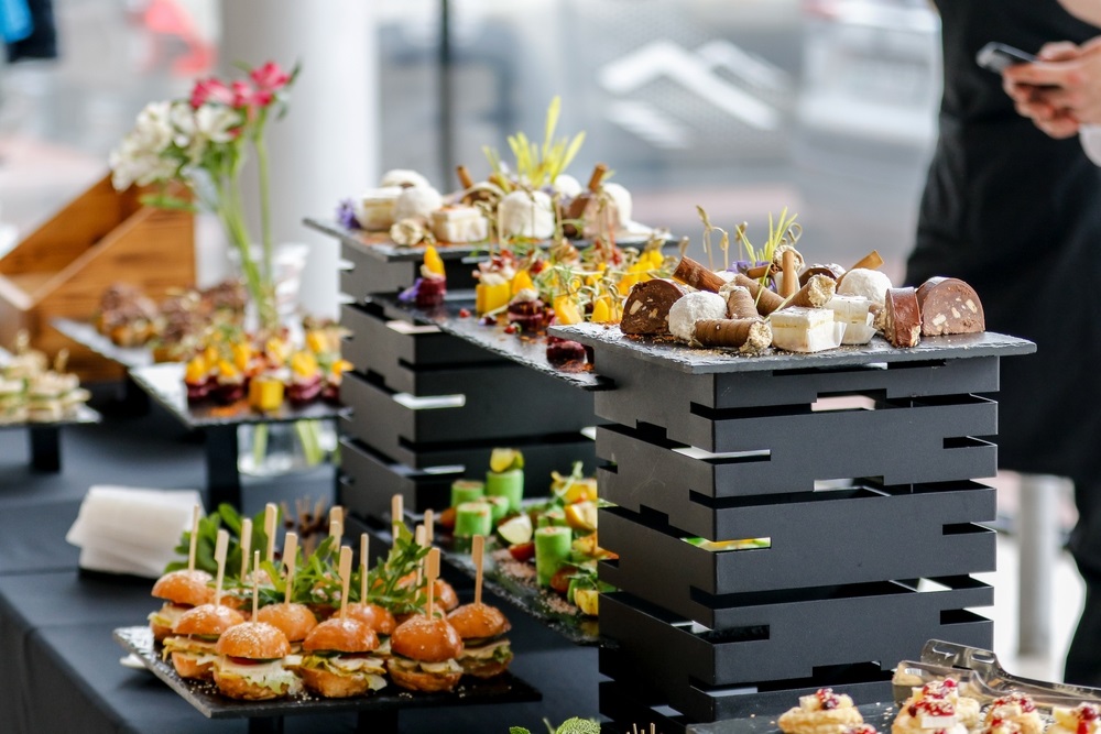 Food-centric corporate event theme with live culinary stations and gourmet tasting dishes