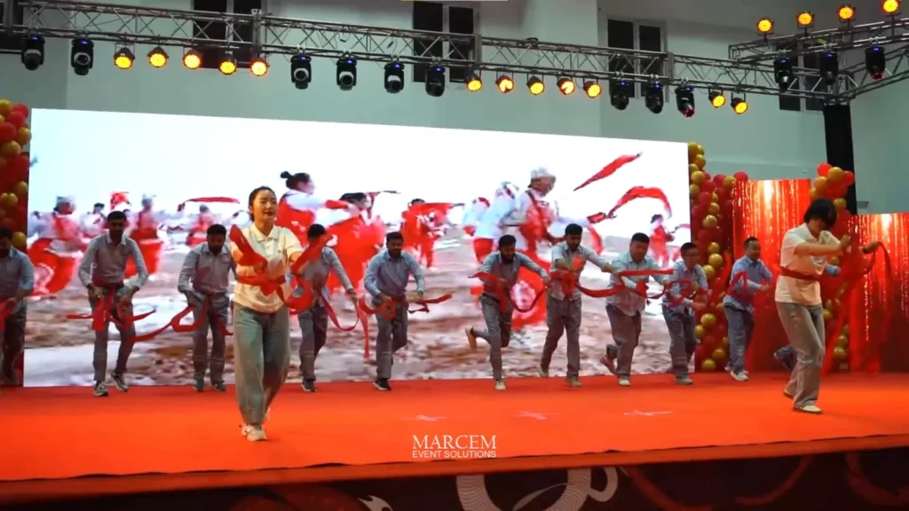 Corporate conference with keynote speaker presenting on stage during a professionally managed business event