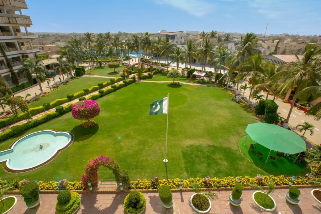 Outdoor lawn setup with Pakistani flag for corporate team building Karachi