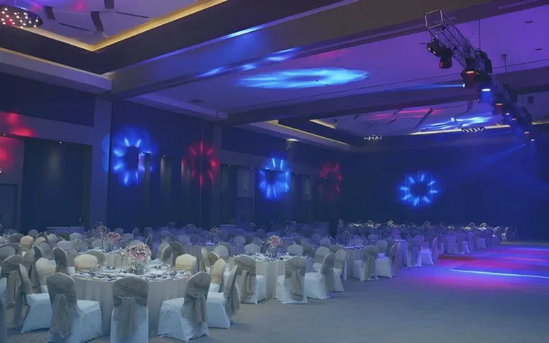 Large corporate event hall with blue purple lighting in Karachi